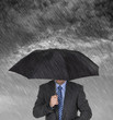 Businessman sheltering