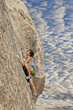 Climber gripping the rock.