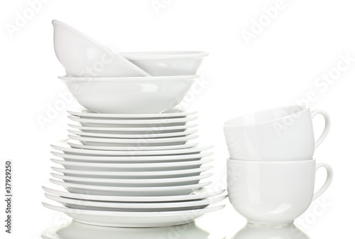 Photo: Clean plates and cups isolated on white Clean plates and cups isolated on white
