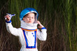 Young boy playing with a toy plane