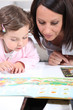 Mother and child looking at a book