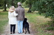 Older couple walking a dog