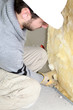 Wall insulation being installed by builder