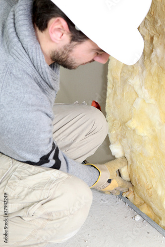 Photo: Wall insulation being installed by builder Wall insulation being installed by builder