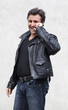 Photo: happy aging man with a black leather jacket happy aging man with a black leather jacket