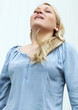 young woman taking a deep breath