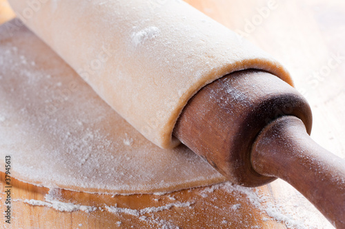 Photo: stretched dough with a rolling pin stretched dough with a rolling pin