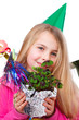 cute girl with party hat and four leaf clover