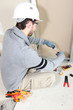 Electrician wiring a room