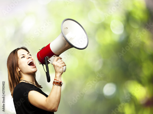 Photo: woman using megaphone woman using megaphone