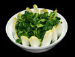 a bowl of leafy green vegetables
