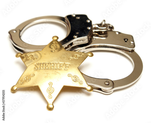 Photo: Sheriff Badge and Handcuffs Sheriff Badge and Handcuffs