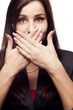 Young businesswoman covers her mouth