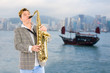 Musician in the background of Hong Kong.