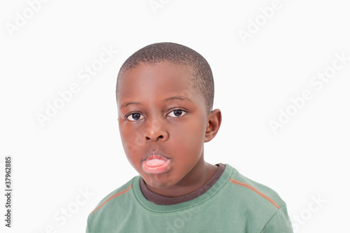 Photo: Boy sticking out his tongue Boy sticking out his tongue