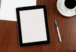 Blank digital tablet on a desk with clipping path for the screen