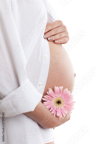 Photo: Pregnant woman with flower Pregnant woman with flower