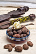 Shea nuts and butter in a spoon