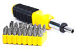 Photo: Screwdriver and a set of heads in a yellow container isolated on Screwdriver and a set of heads in a yellow container isolated on