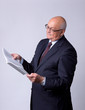 portrait of a successful senior man with book