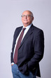 portrait of a successful senior man on gray background