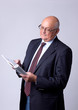 portrait of a successful senior man with book