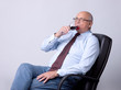 portrait of a successful senior man with glass of wine