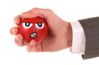 Anzugshand mit Stressball explosiv
