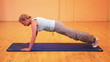 Woman doing pushups in gym