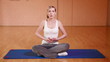 Woman holding thumbs up after fitness exercise