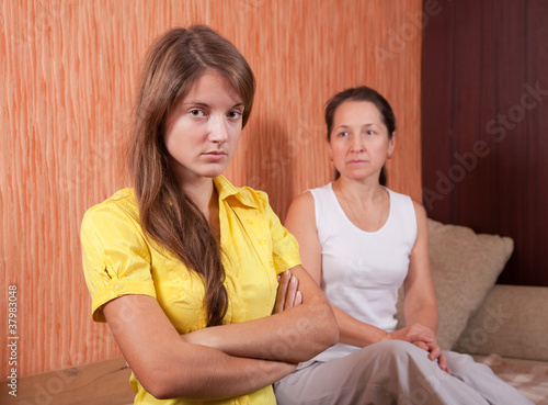 Photo: mother and teenager daughter after quarrel mother and teenager daughter after quarrel