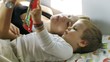 Mother and Baby Boy reading BedTime Stories