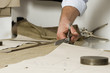 detail of tailor's hand with scissors