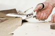 detail of tailor's hand with scissors detail of tailor's hand with scissors