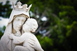 The virgin Mary carrying a baby Jesus statue