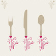 set of forks, spoons and knife with decoratiin