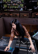 Soundboard technician doing a sound check