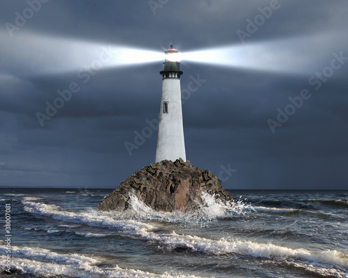 Fototapeta Lighthouse with a beam of light