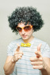 funny guy in afro wig with eyeglasses and ribbon bowtie