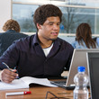 Student behind laptop
