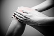 Young woman having knee pain