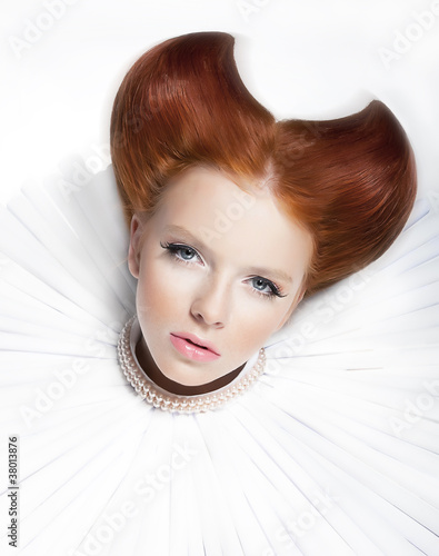 Photo: Glamorous young red hair model in white collar and pearls Glamorous young red hair model in white collar and pearls
