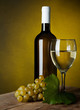 A glass full of wine and bottle