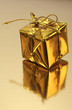 Gold wrapped gift on a golden background