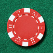 red poker chip on a table