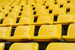 Yellow Empty plastic seats at stadium Yellow Empty plastic seats at stadium