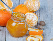 Orange jam on wooden table