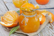 Orange jam on a wooden table