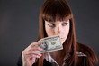 Photo: Serious looking businesswoman with dollars Serious looking businesswoman with dollars