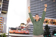 Man with arms outstretched upward